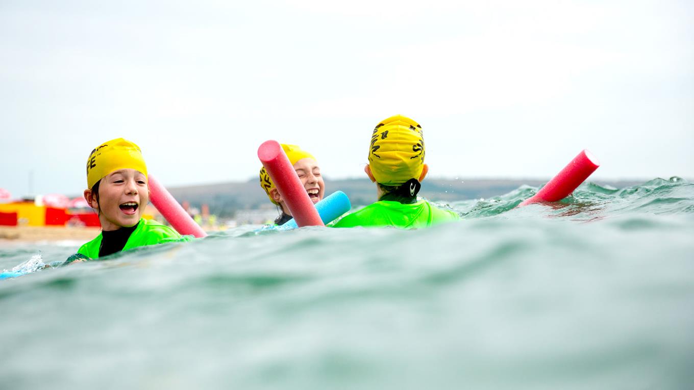 Children swimming in open water